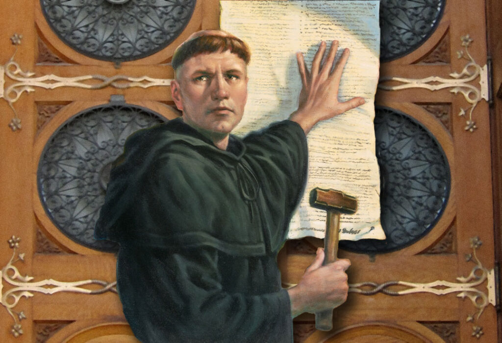 Martin Luther nails his 95 theses to the door of the church at Wittenberg